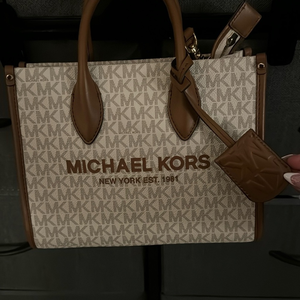 Micheal Kors monogram bag and wallet set (send offers) price is for both total!!
